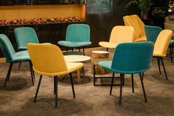 empty conference room with yellow and blue chairs