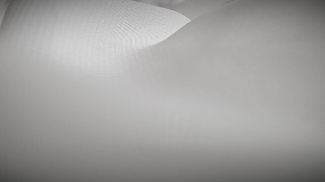 Textured White Fabric with Soft Folds Displayed