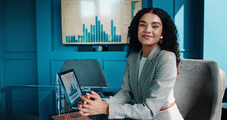 Portrait, smile and business woman with laptop for finance, investment metrics and data with actuary. Computer, corporate professional and happy employee in office with confidence as risk analyst