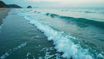 Calming waves washing ashore on a tranquil beach, serene tropical seascape view