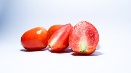 photo of red tomatoes with white background