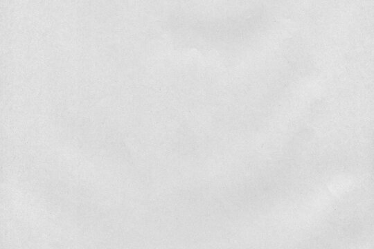 Slightly crumpled natural newsprint texture for news paper backgrounds and wallpapers high detail.