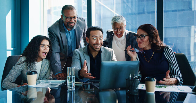Business people, surprise and celebration in office, laptop and financial growth with investment. Employees, group and meeting in workplace, broker and shocked with cooperation, success and wow