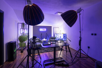 Modern podcast recording studio with professional lighting