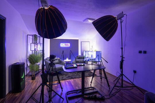 Modern podcast recording studio with professional lighting