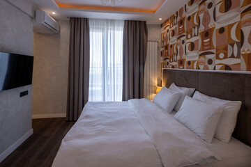 Contemporary double bed hotel room featuring stylish furnishings and clean design