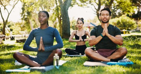 Meditation, prayer hands and group in park for mindfulness, healing aura or spiritual mental...