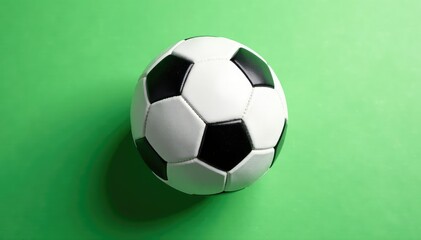 Overhead view of pristine white football, pure white backdrop, game day, sports