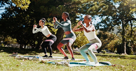Women, squat or yoga class with pilates in nature for exercise or balance at outdoor park. Active...