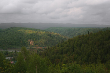 Obraz premium Mountain landscape, after the rain, warm spring weather, a walk in the forest. 