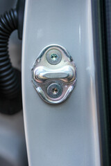 Portrait of a new vehicle door lock catch