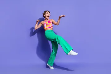 Zelfklevend Fotobehang Photo of crazy cheerful woman wear stylish clothes have fun enjoy summer vacation look empty space isolated on purple color background © deagreez