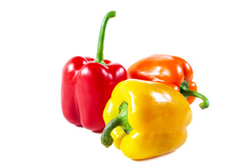 Fresh juicy shiny red, yellow and orange bell peppers. Isolated on white.