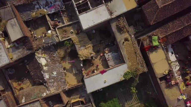 Rows of houses in the slums of Patna, Bihar, with traditional clay tile roofs.