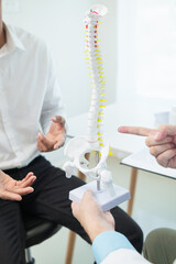 Fototapeta premium patient experienced pain in the spine and sought advice from a doctor so that the doctor could diagnose and treat the back pain because the back pain made it impossible for him to live his normal life
