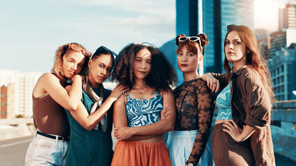 Confident women, fashion and portrait of group with streetwear, style or edgy clothes in city. Cool, trendy girls and outdoor together with urban outfit, culture and gen z friends with arms crossed