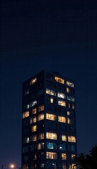 Fototapeta premium Night-lit modern building; abstract black backdrop , building, urban landscape, urban