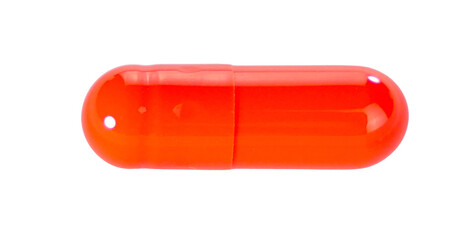 One orange capsule pills isolated on white background.