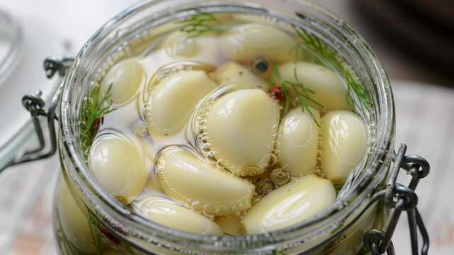 Unique garlic preservation method shines in a savory jar filled with flavors and aromas in a rustic kitchen atmosphere