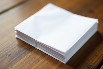 Fototapeta premium Stack of crisp white envelopes on wooden surface, background, mailing, post