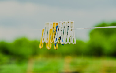 Clothespins Wait on a Line Under a Cloudy Sky in a Rural Setting During the Afternoon Hours
