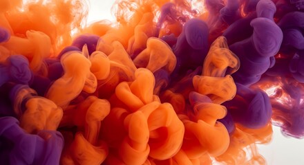 Abstract orange and purple ink swirling in water