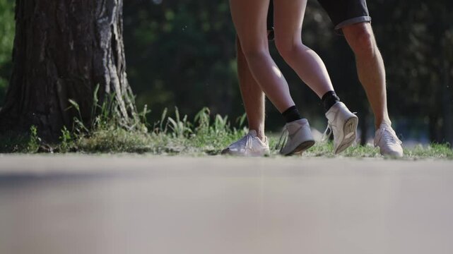 Couple dancing in park, cinematic slow motion shot with selective focus