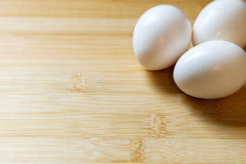 white eggs on wooden table room for copy space