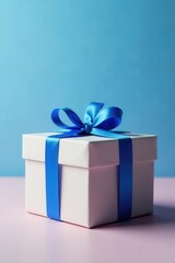 Obraz premium Luxury gift box with blue bow, monochrome light blue backdrop, birthday present, gift wrapping, corporate gift box