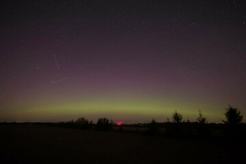 Green and red aurora in the night sky