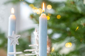 Christmas is coming.White Christmas wreath and candles