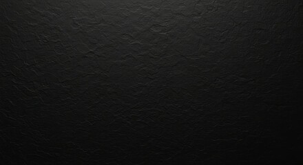 Fototapeta premium A textured black surface resembling leather or stone, suitable for backgrounds.