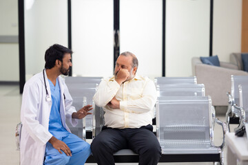 Obraz premium advice, consult : Asian indian male nutritionist doctor giving advice, consult to fat man stroke patient, Preventive Medicine Health Check-up in Progress