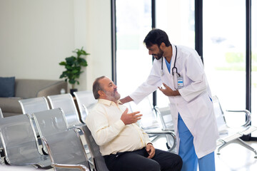 advice, consult : Asian indian male nutritionist doctor giving advice, consult to fat man stroke...
