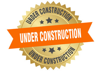 under construction. under construction round orange and gold label isolated on transparent background
