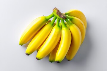Bunch of ripe yellow bananas on a light background showcasing their natural beauty and freshness