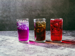 A lot of Soft drinks in colorful and flavorful glasses on the table,Glasses with sweet drinks with...