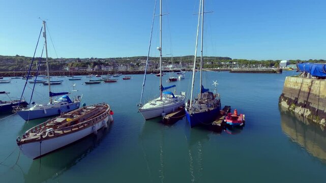 Tranquil Marina Scene with Sailboats Docked in Howth Harbour, Ireland