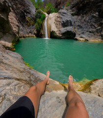 Tourist resting at la magdalena waterfall in tlatlauquitepec, puebla, mexico