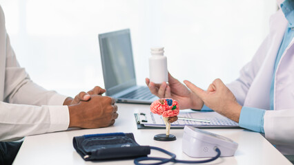 doctor is explaining use of brain tonics after examining patient brain to treat short term memory...