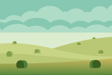 foggy field with hay bales scattered across 