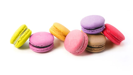 Pile of macaron cookies in various flavours and colours isolated on white background.