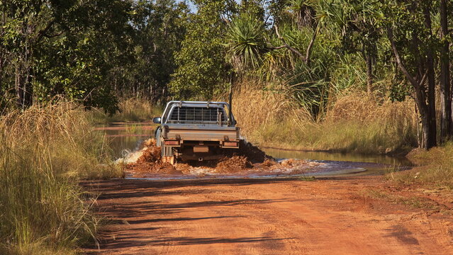 Crossing of flooded road in Leaning Tree Lagoon Nature Park, Northern Territory, Australia 
