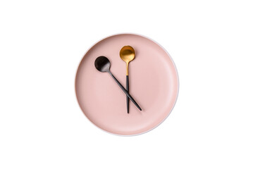 Empty plate with devices in the form of clock hands as a conceptual background for lunch time