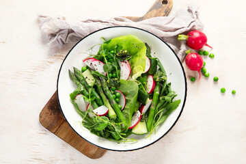 Green salad with asparagus and radish. Healthy eating.