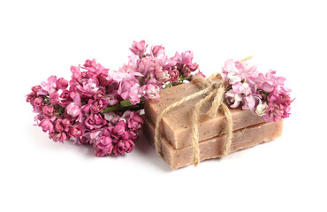Soap bars and lilac flowers isolated white