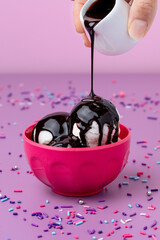 Ice cream with chocolate sauce drizzle