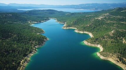 Obraz premium Aerial view of Lake Tahoes blue-green waters surrounded by forested hills, untouched scenery, no people
