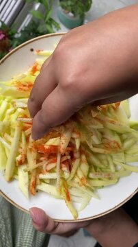 peeled mangoes in a bowl. Fresh sweet and sour fruits. Fresh raw green mango ready to be pickled or smashed. fresh young mango and leaf, tropical fruit. mango slice.