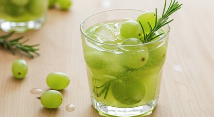 Fototapeta premium A beautifully crafted green grape cocktail with fresh rosemary, ice, and grapes.